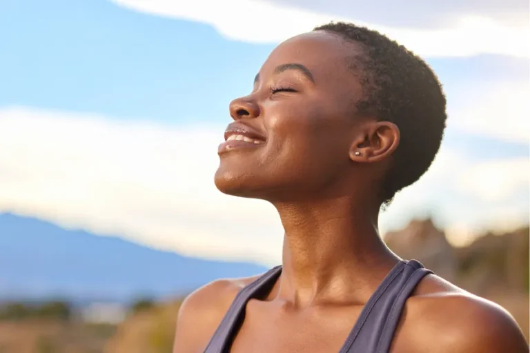 Woman outdoors with eyes closed